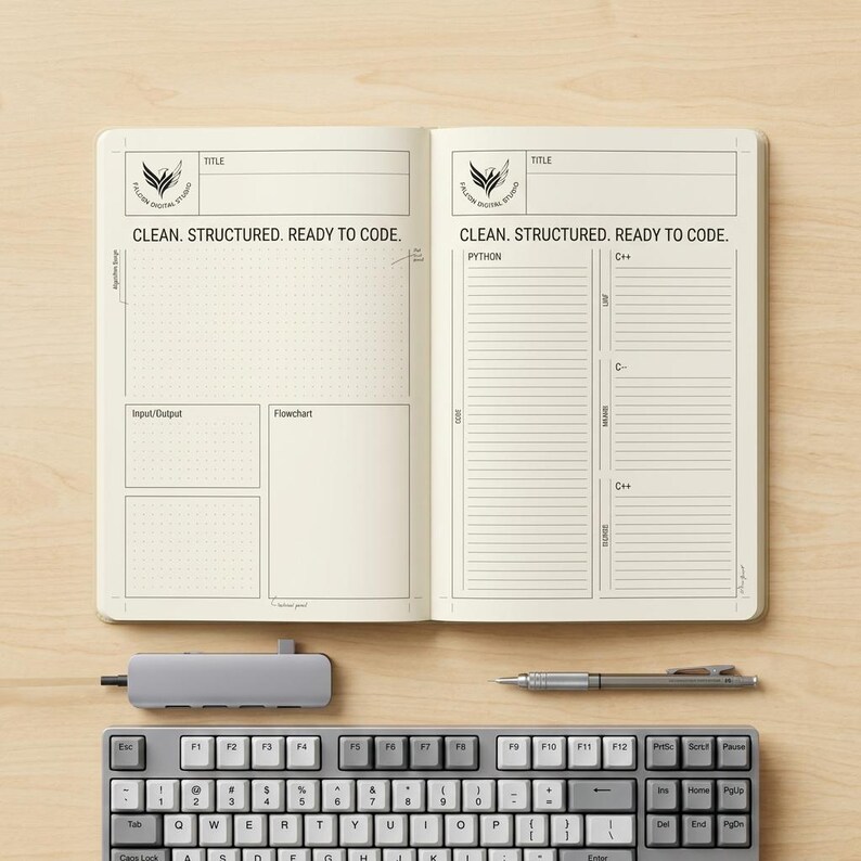 May include: An open notebook with cream-coloured pages featuring pre-printed sections for coding, including headers like Title, Algorithm, Input/Output, Flowchart, Python, and C++. The text reads CLEAN. STRUCTURED. READY TO CODE. with a logo.