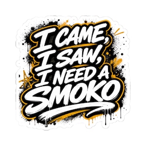 May include: A die-cut sticker featuring the white text I CAME, I SAW, I NEED A SMOKO in a bold, brush-style font. The design includes black and yellow paint splatter effects, drips, and a small yellow star graphic on a white background.