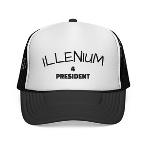 May include: A white and black trucker cap with a mesh back and a solid front panel. The front features the black text ILLENIUM arched over the number 4 and the word PRESIDENT in a bold, sans-serif font. The peak of the cap is solid black.