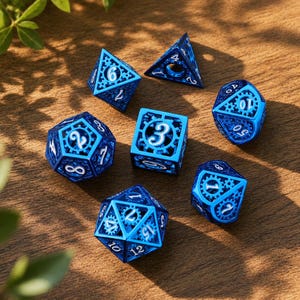 May include: A set of seven polyhedral dice in a metallic blue finish. Each die features an intricate openwork gear design with white numbers. The set includes a four-sided, six-sided, eight-sided, ten-sided, percentile, twelve-sided, and twenty-sided die.