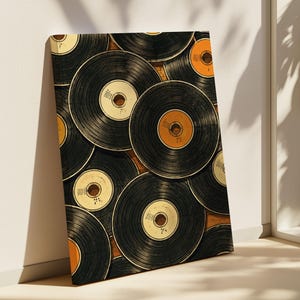May include: A rectangular wall art print featuring a dense, overlapping pattern of black vinyl records. The records have circular center labels in shades of cream, white, and orange, with visible grooves across the black surfaces of the discs.