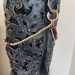 Three chains, gold chain, multi chain (black,red,brown,white) matching accent chain with basic gold clips. Bootlets, bling for your boots.