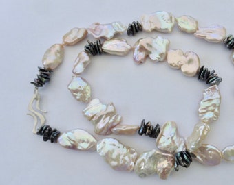 Attractive pearl necklace made of large Keshi pearls, best shine, hand-forged silver clasp