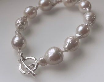 Bracelet made of bright white real Keshi beads with silver lock