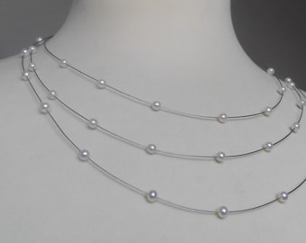 Fine delicate bridal necklace made of real pearls 3-row floating on wire with silver