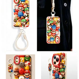 Op de afbeelding: Een telefoonhoesje met een 3D-collage van Super Mario-personages, waaronder Mario, Luigi en prinses Peach, samen met vraagtekenblokken en paddenstoelen. Het hoesje heeft een wit polsbandje dat aan een ring aan de onderkant is bevestigd.