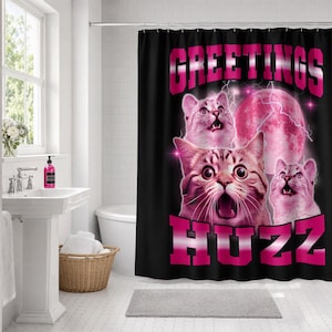 May include: A black shower curtain featuring the text GREETINGS HUZZ in bold pink letters. The design includes three cats with wide-eyed expressions, a large pink moon, and lightning bolts, all rendered in a vibrant pink and black color palette.