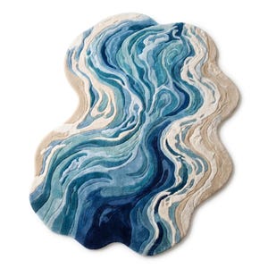 Puede incluir: Una alfombra de forma irregular con un patr&oacute;n abstracto y fluido de remolinos en tonos azul, turquesa y blanco que imitan corrientes de agua, bordeada por secciones de color beige claro que recuerdan a orillas arenosas con superficie texturizada.
