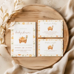 May include: A set of three rectangular paper cards featuring a watercolor pumpkin wagon illustration, green bows, and orange text. The cards include a baby shower invitation for Olivia, a books for baby request, and a diaper raffle entry card.