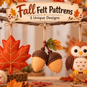 May include: Three felt ornaments hanging from a branch, featuring a maple leaf, two acorns, and an owl. A wooden sign above reads Fall Felt Pattrens 3 Unique Designs. The ornaments are crafted with visible stitching and twine loops.