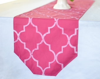 Moroccan style hot pink table runner with hand stenciled white quatrefoil design