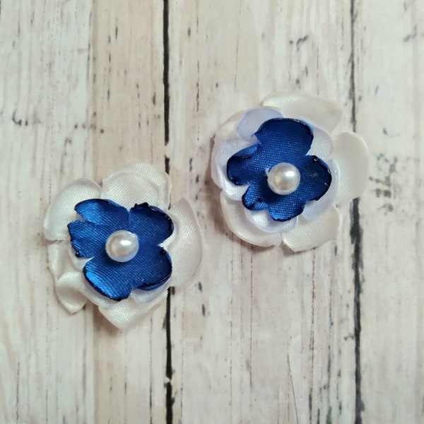 1 inch electric blue and white satin flower embellishments, with faux pearl centers, cream and blue decorations