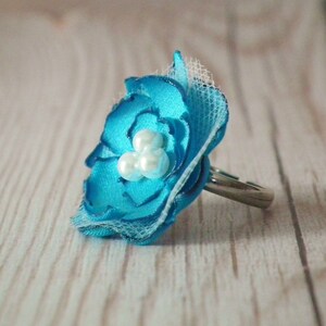 Turquoise colored satin flower ring with three faux pearls - size 6.5+ adjustable