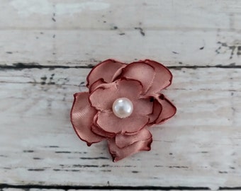 1 inch rose gold colored satin flower embellishments with faux pearl center