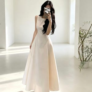 cream graduation dress The dreamiest long dresses, Come by for all your essentials. , #graduationdresses #graddresses #whitedresses #longsummerdress #springfashon fitting bodycon silhouette that holds you in Undergarments Junior High School Graduation Party