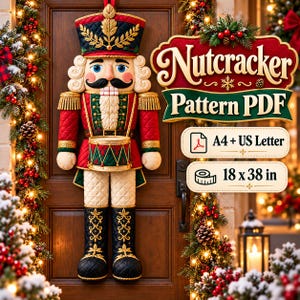 May include: A hanging nutcracker decoration featuring a red, green, and gold uniform with a drum, displayed next to text reading Nutcracker Pattern PDF, A4 + US Letter, and 46 x 97 cm, set against a wooden door with festive holiday greenery.