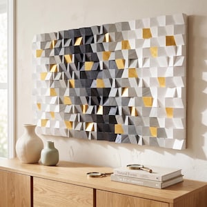May include: A rectangular wall art piece composed of numerous small, protruding wooden blocks in a gradient of black, grey, and white, interspersed with individual blocks finished in a metallic gold paint, creating a textured, three-dimensional surface.