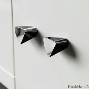 Kastknoppen kiezelsteen, moderne ladegrepen, zilveren metalen hardware, minimalistische meubelgrepen