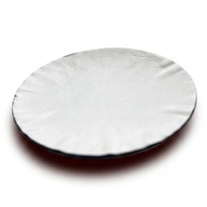 May include: A circular, white, adhesive-backed sticker with a slightly wrinkled, textured surface. The edges of the round label are thin and flat, while the centre area shows subtle folds and creases across the matte white material.