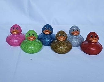 ¡Un dólar por patito! 6 patitos de goma con purpurina