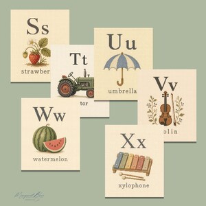 May include: A set of six educational alphabet cards featuring the letters S, T, U, V, W, and X. Each card displays a corresponding illustration: a strawberry, a green tractor, a blue umbrella, a violin, a watermelon, and a colorful xylophone.