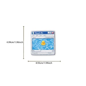 May include: A square sticker featuring a computer Recycle Bin window interface with a yellow rubber duck floating in blue water. The sticker measures 1.96 inches in height and 1.94 inches in width, as indicated by the visible measurement lines.