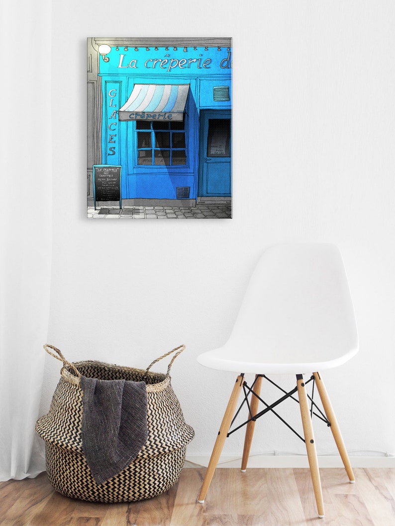 a white chair and a blue store front