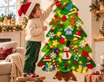 May include: A large green felt Christmas tree wall hanging decorated with various colorful felt ornaments including a snowman, gingerbread man, reindeer, snowflakes, and gift boxes, illuminated by a string of warm white LED lights.