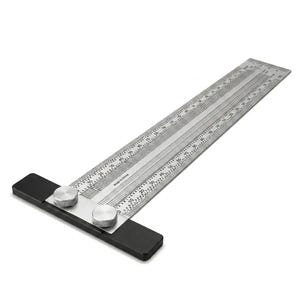 May include: A silver metal T-square ruler featuring a black base and two circular knurled knobs for adjustment. The ruler blade is marked with precise metric and imperial measurements, including increments in centimeters and inches along the edges.