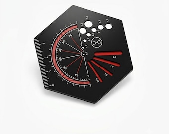 May include: A black hexagonal drafting tool featuring white and red markings, including a circular protractor with degree measurements, a linear ruler along one edge, and various circular and slotted cutouts labeled with numerical sizes.