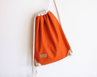 Burnt orange drawstring backpack