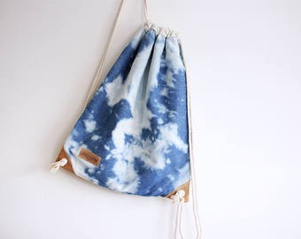 Reverse shibori drawstring backpack