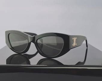 Gafas de sol ovaladas extragrandes Celine CL40194U 25A con montura blanca y lentes grises, protección UV 100%.
