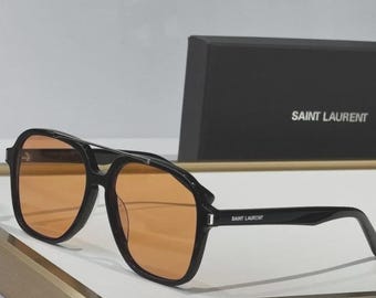 Gafas de sol Saint Laurent SL545 negras con lentes naranjas para hombre y mujer, de diseño de lujo auténtico.