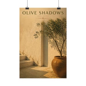 May include: A vertical wall art print featuring a warm-toned scene of a potted olive tree against a textured beige wall with stone steps. The text OLIVE SHADOWS and LOCK SUPPLY is printed in dark green at the top center of the composition.