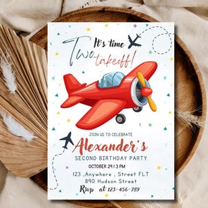 Puede incluir: Una tarjeta de invitación de cumpleaños rectangular con un avión de dibujos animados rojo, confeti de colores y el texto: It's time Two takeoff! JOIN US TO CELEBRATE Alexander's SECOND BIRTHDAY PARTY OCTOBER 29 | 3 PM 123, Anywhere, Street FLT 890 Hudson Street RSVP at 123-456-789.