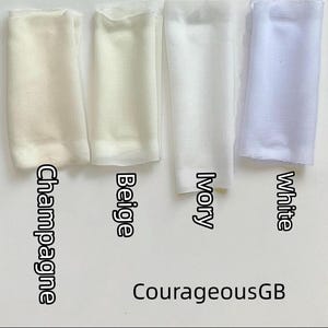 May include: Four rectangular fabric swatches arranged side by side in shades of champagne, beige, ivory, and white. Each swatch is labeled with its corresponding color name in black text. The text CourageousGB is printed at the bottom.
