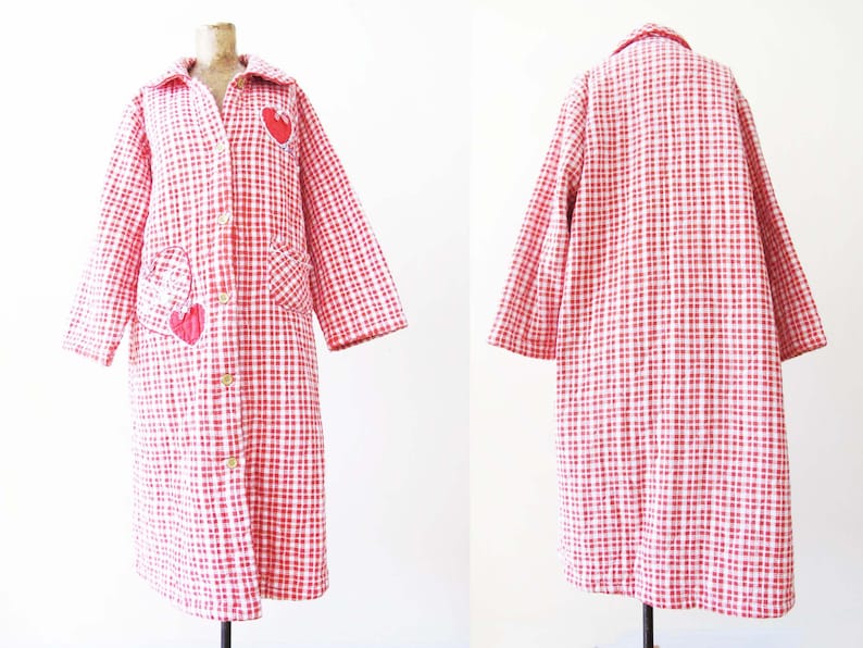 May include: A long red and white gingham robe with a button front and heart-shaped patches.
