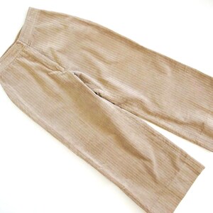 May include: A pair of wide-leg corduroy pants in a light beige color. The pants have a straight leg and a high waist.