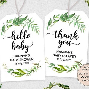 May include: Two printable tags with a green leafy border. The first tag says "hello baby" with the text "Hannah's Baby Shower 18 July, 2020" below. The second tag says "thank you" with the text "Hannah's Baby Shower 18 July, 2020" below. The text "INSTANT DOWNLOAD EDIT & PRINT YOURSELF with Templett" is in a circle on the right side of the second tag.
