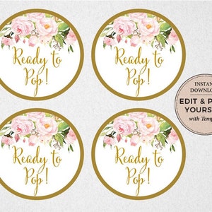 May include: Four round, gold-rimmed stickers with a white background and pink floral designs. The text "Ready to Pop!" is written in gold lettering on each sticker.