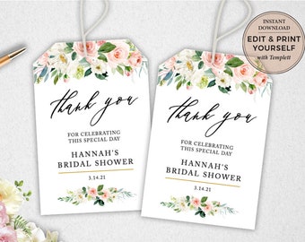 May include: Two white thank you tags with pink and white floral designs. The text reads "Thank you for celebrating this special day. Hannah's Bridal Shower 3.14.21".