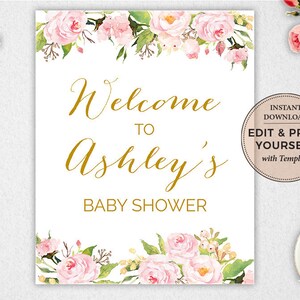 May include: A white printable sign with a floral border and gold text that reads "Welcome to Ashley's Baby Shower". The sign also includes a small circle with the text "Instant Download Edit & Print Yourself with Templett".