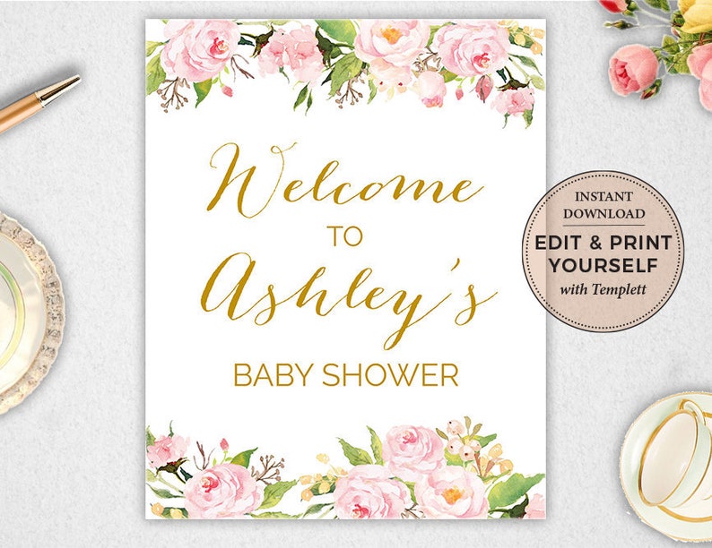 May include: A white printable sign with a floral border and gold text that reads "Welcome to Ashley's Baby Shower". The sign also includes a small circle with the text "Instant Download Edit & Print Yourself with Templett".
