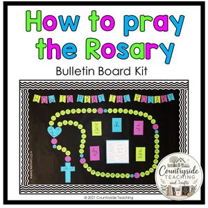 May include: A bulletin board kit titled How to Pray the Rosary featuring a black background with a large circular rosary graphic made of green beads, pink cross markers, and a blue cross. Includes colourful text banners and instructional cards.