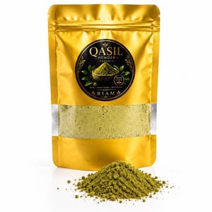 May include: A gold-coloured stand-up pouch containing Qasil powder, with a circular black label featuring the text QASIL POWDER ORGANIC and RIAM. A pile of the fine, light green botanical powder is displayed in front of the sealed pouch.