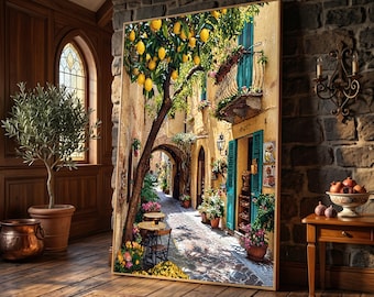 May include: A large rectangular wall art print depicting a sunlit Mediterranean street scene with a lemon tree, stone buildings, teal shutters, and a cobblestone path. The painting features warm yellow tones, green foliage, and a small outdoor cafe area.