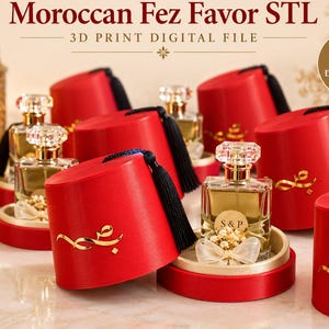 May include: A 3D print digital file for a Moroccan Fez favor container. The red cylindrical container features a black tassel and gold Arabic calligraphy. It is designed to hold a square glass perfume bottle with a clear cap and a small white bow.