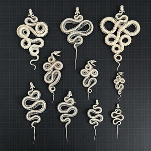 May include: A collection of ten off-white snake skeletons arranged in a grid. Each skeleton displays a detailed skull, a long vertebral column, and rib structures, with the snakes coiled in various positions and sizes against a dark grid background.