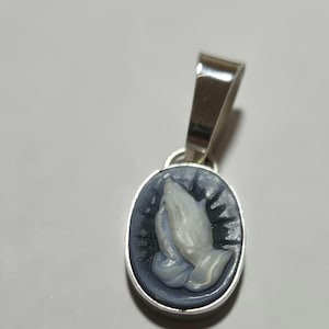 Cameo with Praying hands , carved in black banded agate.  Ultrasonically carved in germany by professional stone carvers.